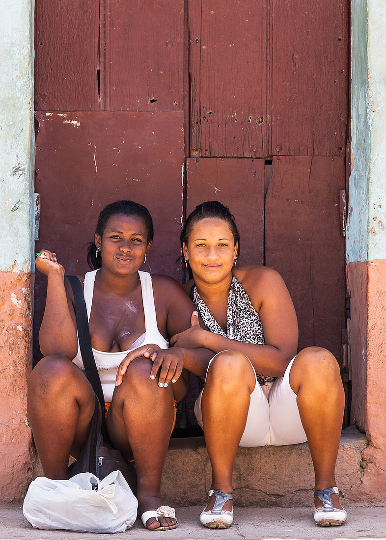 Two laughing Cuban girls, Trinidad, Cuba