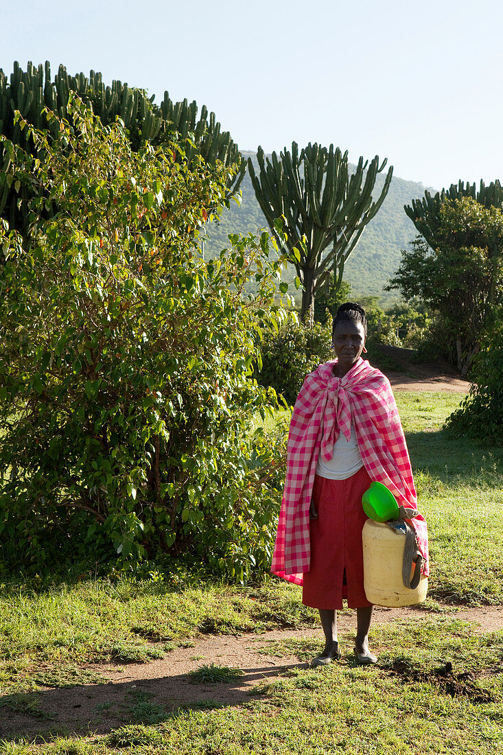 Masai woman fetching water, Masai, Safari, National Park, Masai Mara, Maasai Mara, Serengeti, Kenya