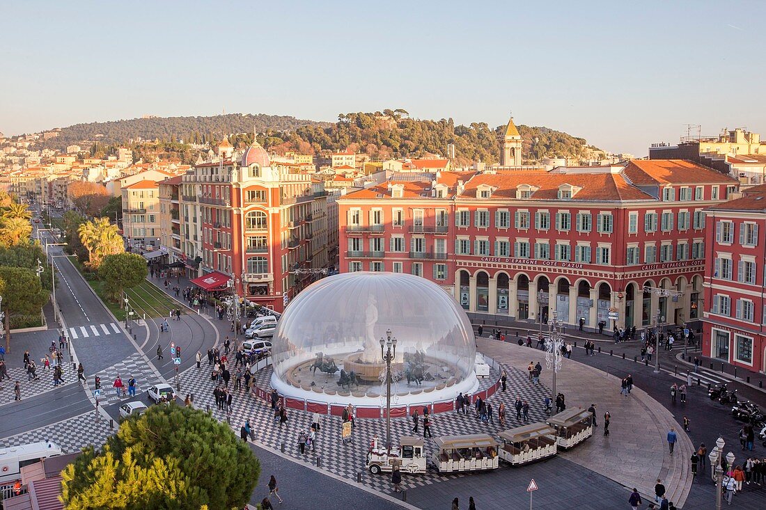 France, Alpes-Maritimes, Nice, the Promenade du Paillon, the reflecting pool of 3000 m2 and the fountains of the Place Massena, overlooking the clock tower of the former convent of brothers minors of St. Francis