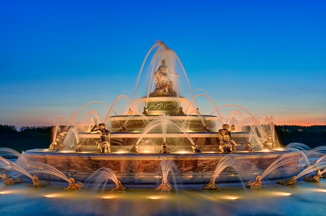 France, Yvelines, Versailles, gardens of the palace of Versailles listed as World Heritage by UNESCO, Latona fountain illuminated