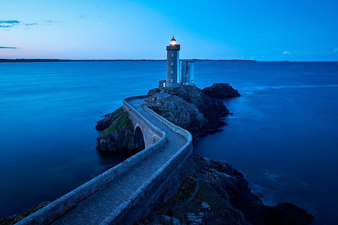 France, Finistere, Iroise Sea, Goulet de Brest, Plouzane, Pointe du Petit Minou, Petit Minou lighthouse before sunrise (aerial view)
