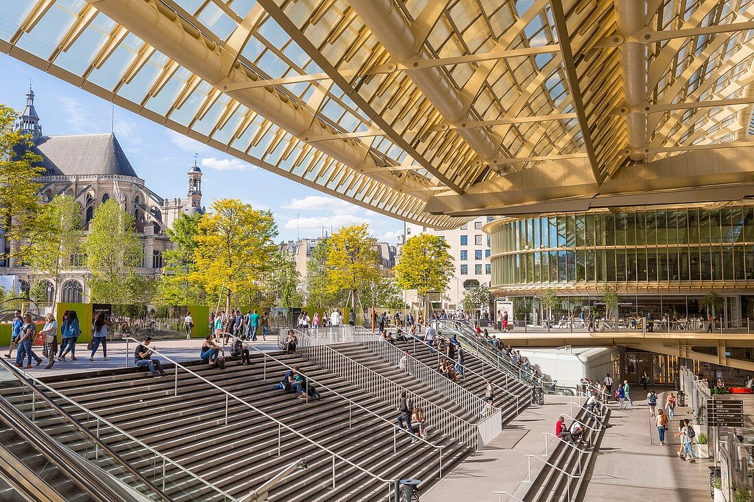 France, Paris, the canopy of the Forum des Halles made of glass and metal, designed by Patrick Berger and Jacques Anziutti and inaugurated on 5 April 2016, and the church of Saint Eustache