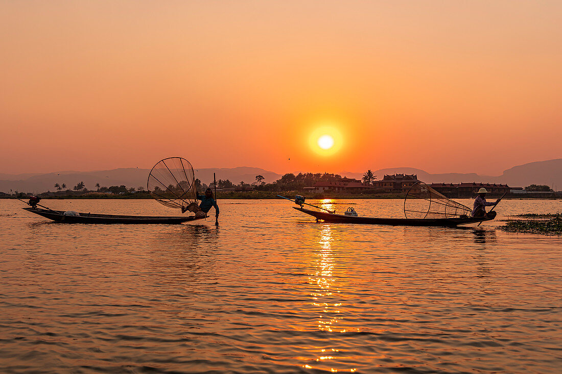 One-leg rower on Inle Lake at sunset on boat trip, Nyaung Shwe, Myanmar