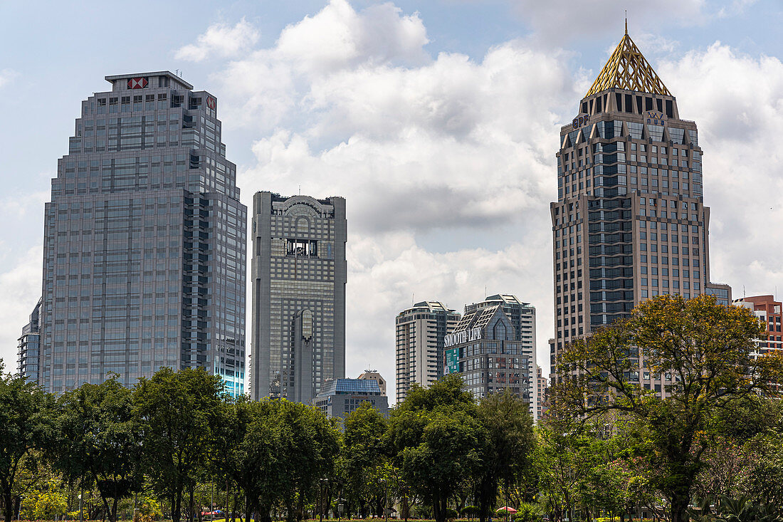 View from Lumphini Park to high-rise buildings in Silom, Bangkok, Thailand