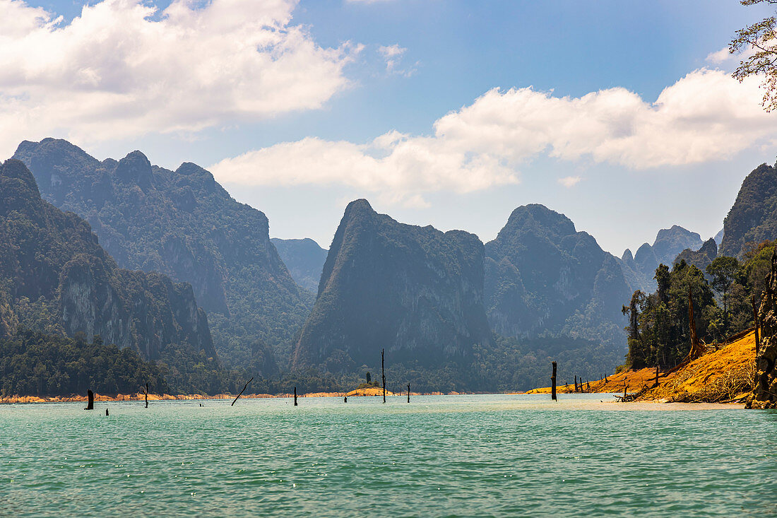 Drive over the Ratchaprapha lake with high karst rocks in the Khao Sok National Park, Khao Sok. Thailand