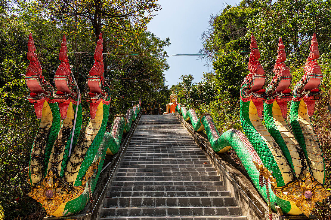 Stairs with colorful beats to the upper part of Wat Koh Phayam temple, Koh Phayam. Thailand