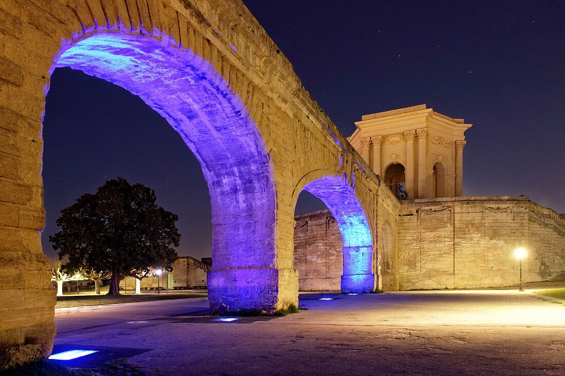 France, Herault, Montpellier, Saint Clement Aqueduct lighting by the artist Yann Kersale and water tower