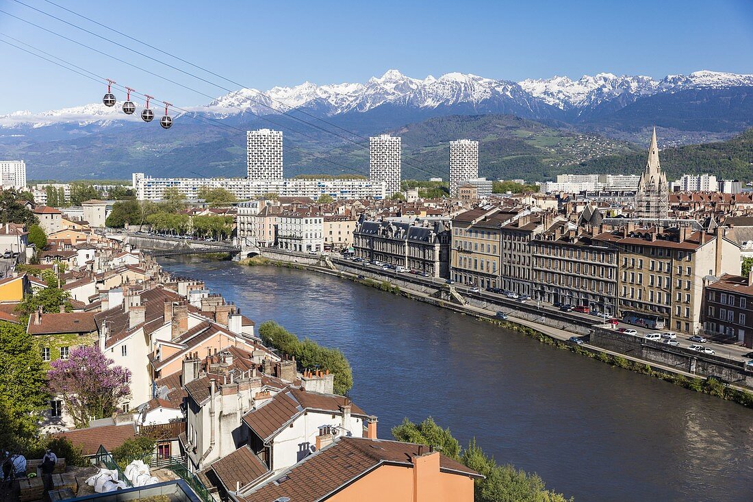 France, Isere, Grenoble, view of Grenoble-Bastille cable car and its Bubbles, the oldest city cable car in the world, view of the 13th century Saint Andre church and Belledonne massif