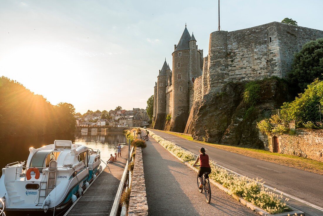 France, Morbihan, Josselin, cyclist on the towpath along the canal from Nantes to Brest