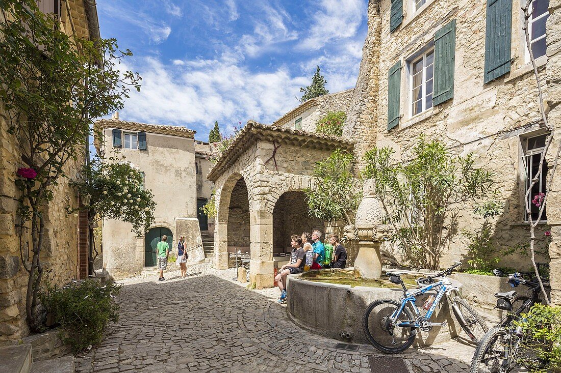 France, Vaucluse, Seguret, labelled Les Plus Beaux Villages de France (The Most Beautiful Villages of France), the Fontaine des Mascarons (fountain with grostesque mask) of the 15th century