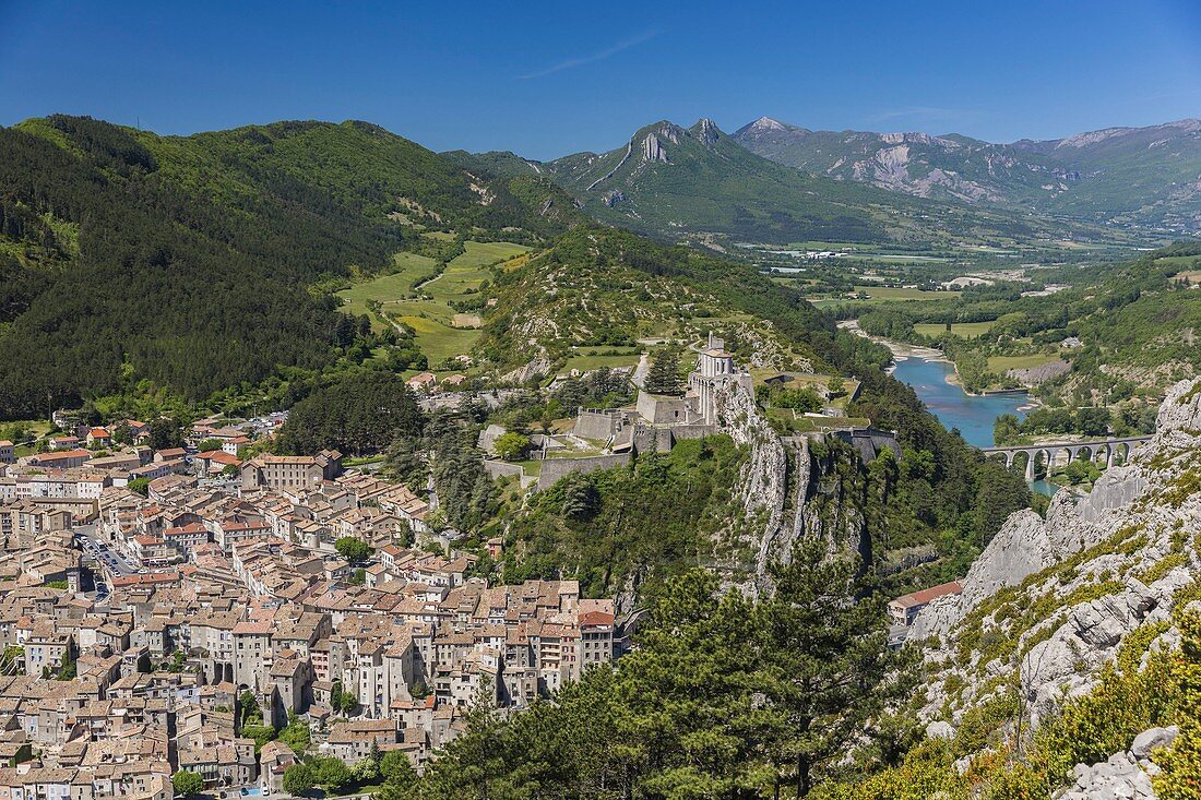 France, Alpes de Haute Provence, Sisteron, the old town and the Citadel, XIV XVI century, historical monument, view of Le Buech and railroad bridge