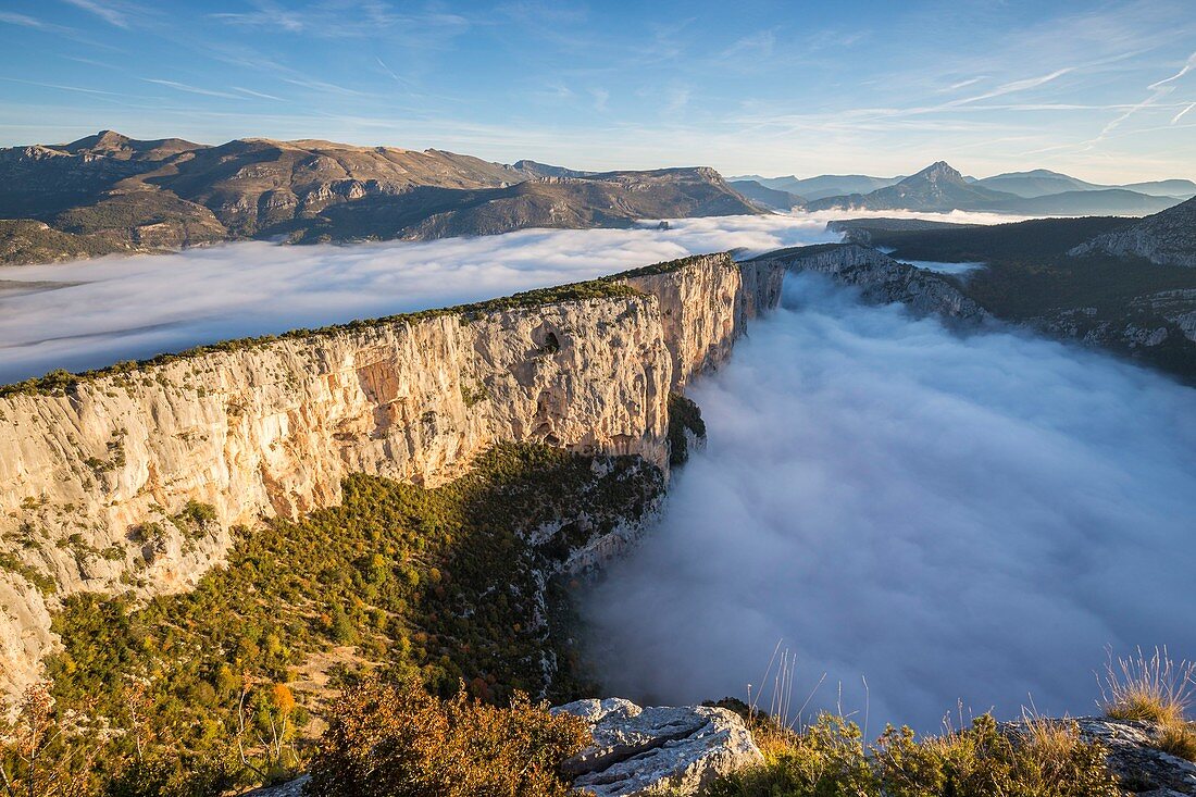 France, Alpes de Haute-Provence, regional natural reserve of Verdon, Grand Canyon of Verdon, cliffs of the Barres of Escalès seen by the belvedere of the Dent d'Aire, morning autumn fogs