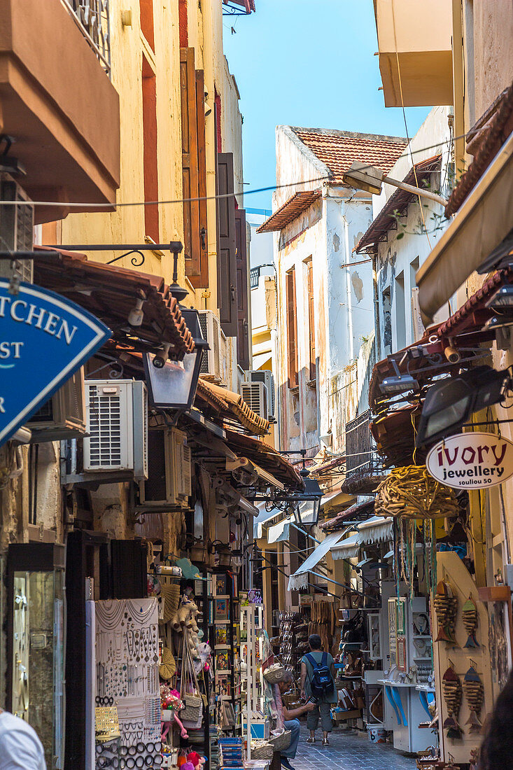 Historic narrow streets with souvenir stalls in the old town of Rethymno, North Crete, Greece