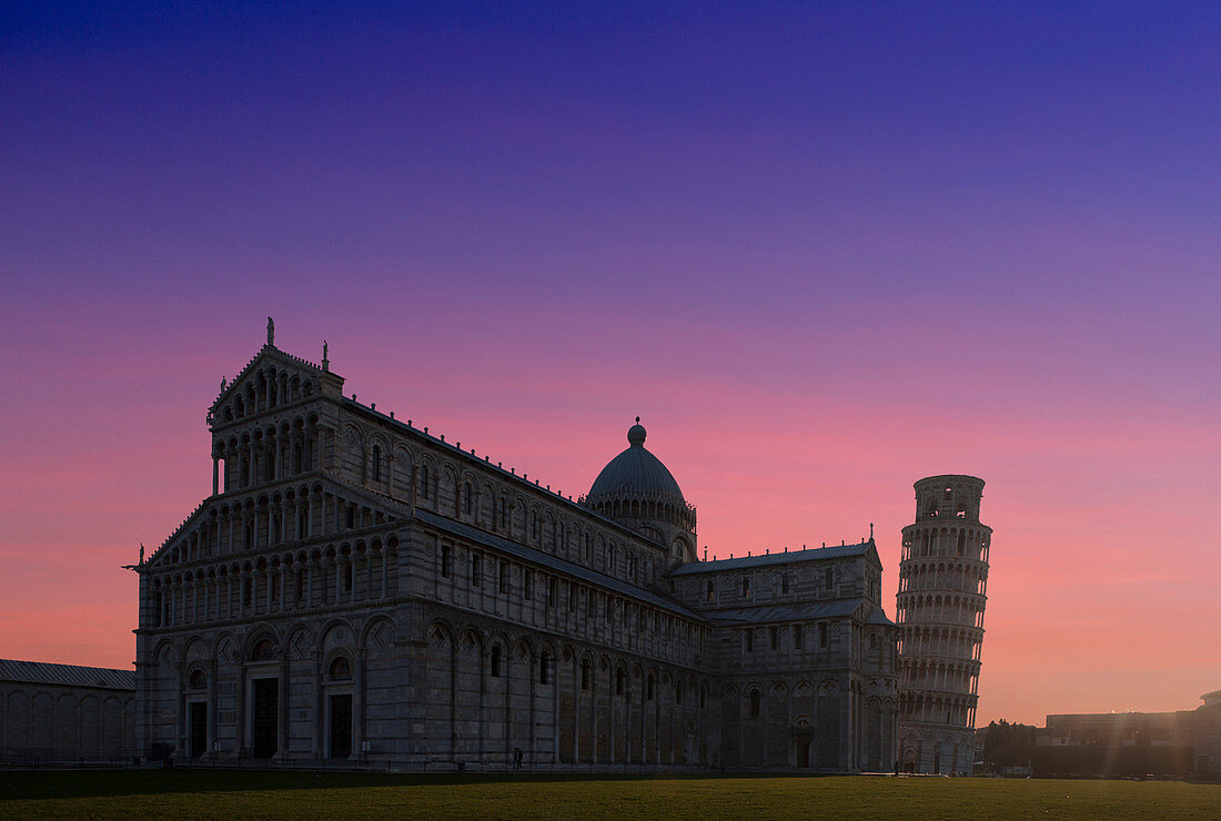 Leaning Tower of Pisa and Piazza dei Miracoli at sunset in Tuscany, Italy