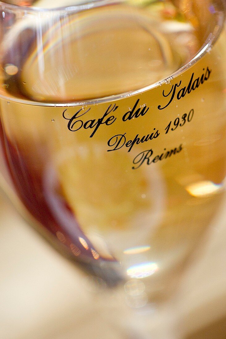 France, Marne, Reims, champagne flute at Cafe du Palais