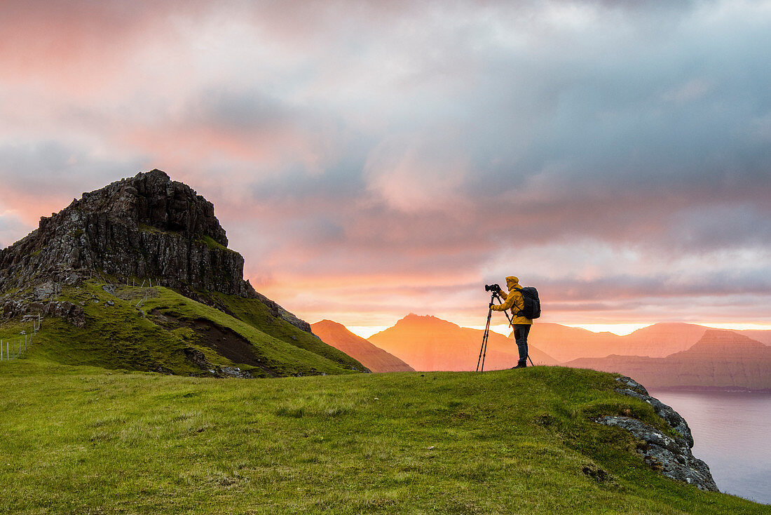 The photographer captures the sunrise, Eysturoy island, Faroe Islands, Denmark