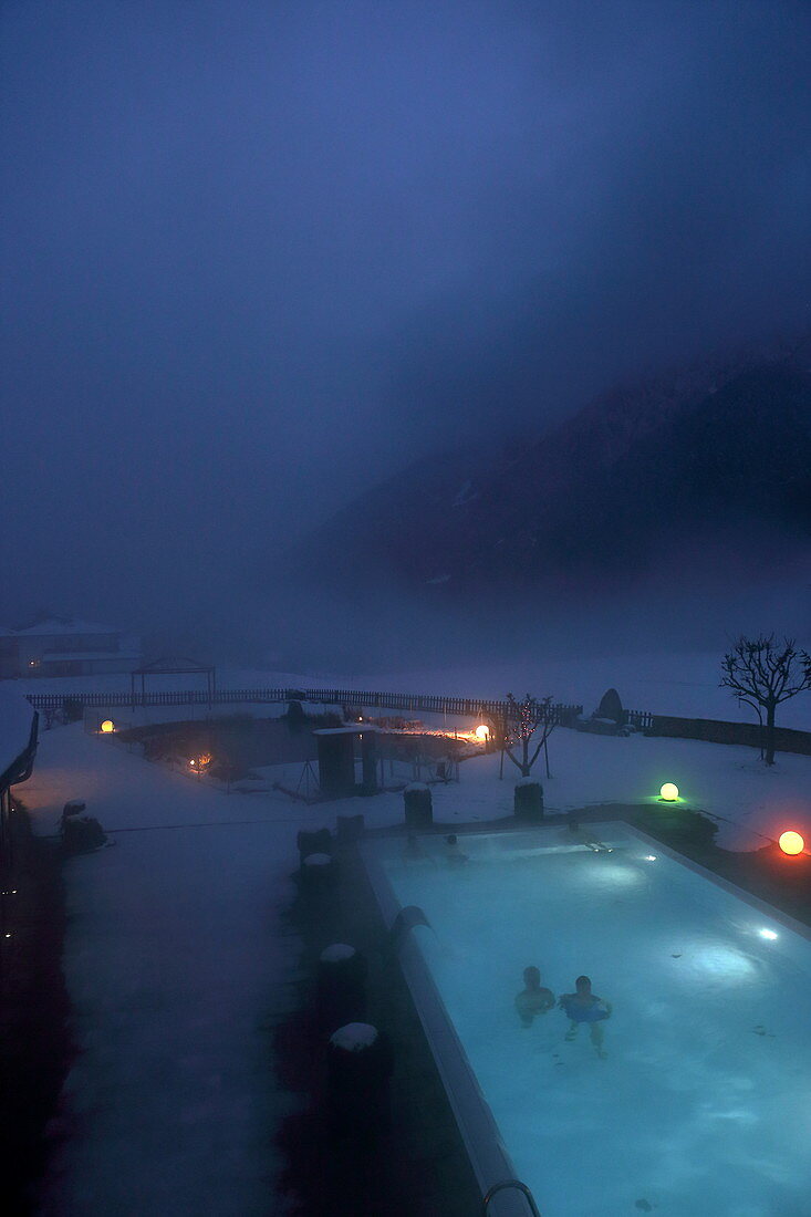 Pool of the Biohotel Holzleiten in the first snow, late autumn on the Mieminger Plateau, Tyrol