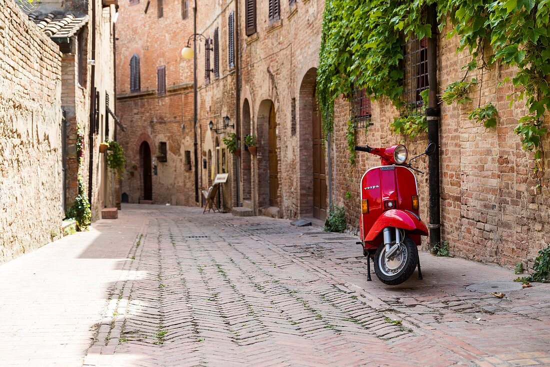 Italy, Tuscany, Florence Province, Certaldo, Vespa scooter in the village
