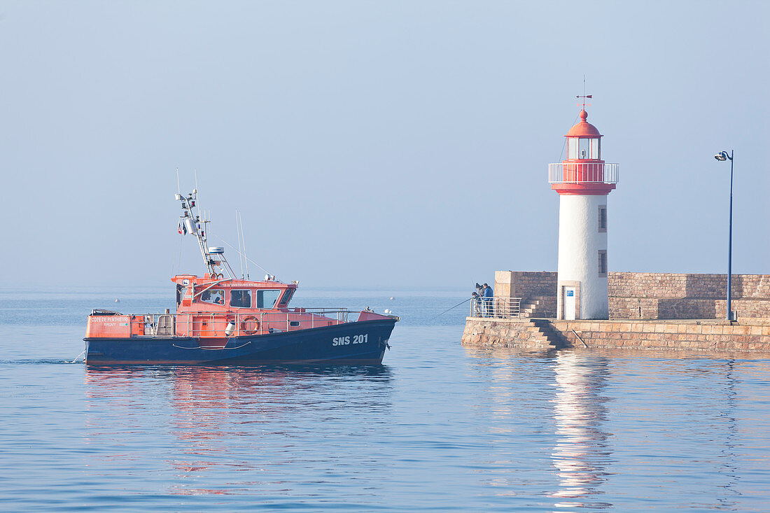 Sea rescue ship in the port of Erquy on a foggy morning. Cote d Armor, Brittany, France