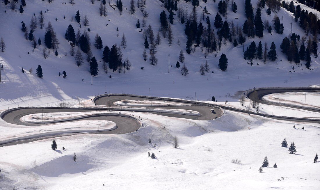 At the pass road of the Pordoi Joch, snow, Dolomites, Trentino in winter, Italy
