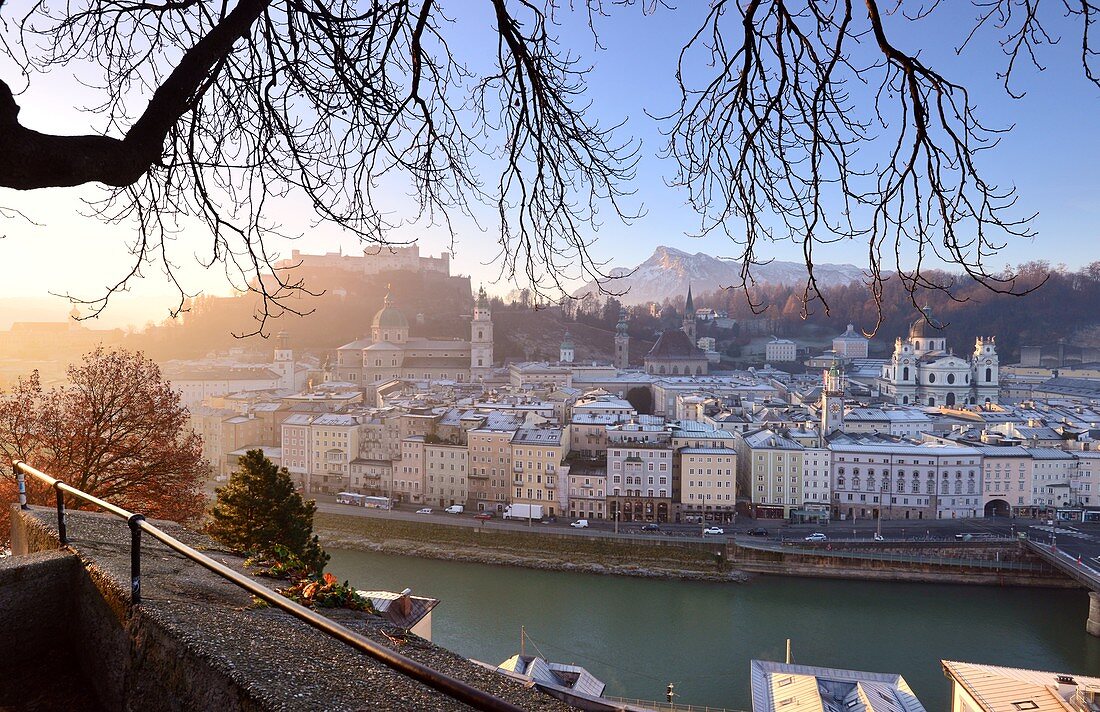 Morning view from Kapuzinerberg, city view, panorama, branches, lights, river, castle, cathedral, reflections, Stadthäuserm Salzburg in winter, Austria