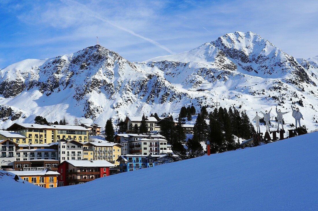 View of Obertauern, ski resort, pass, mountains, snow, skis, lights, winter in Salzburg, Austria