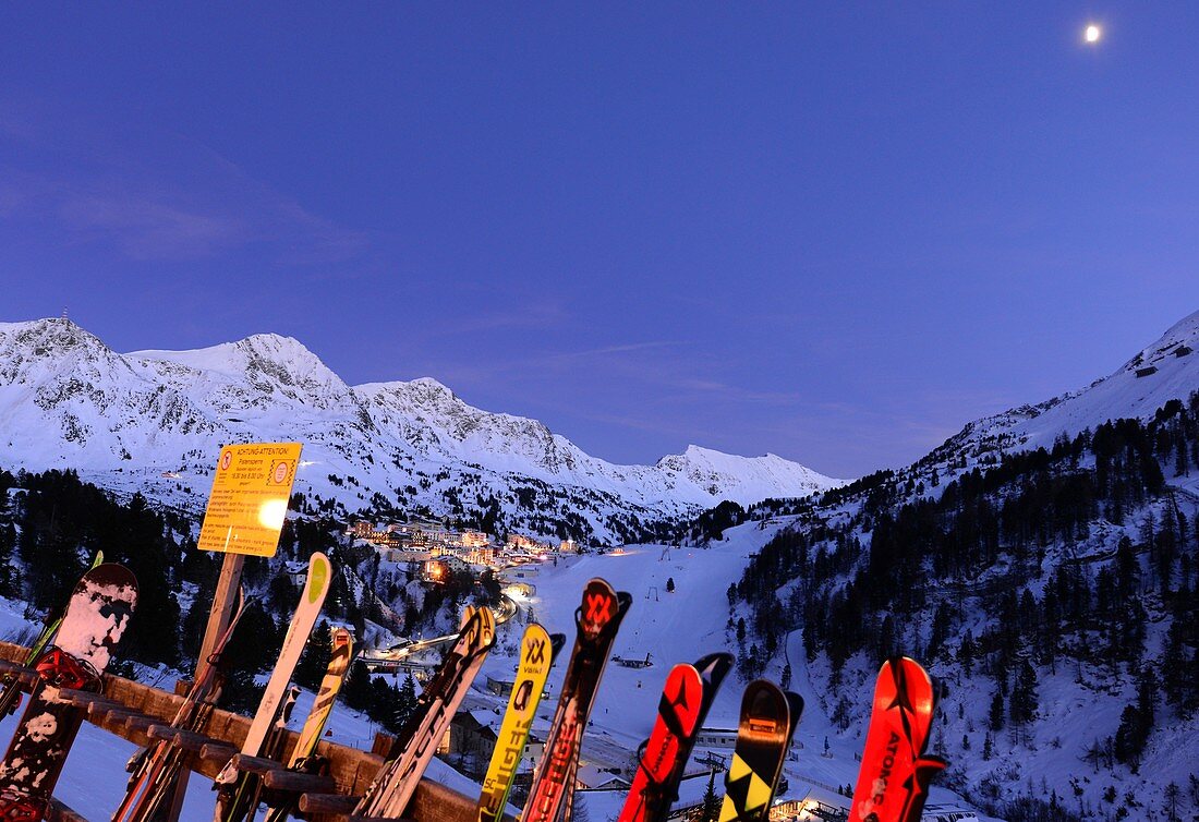 Evening view of Obertauern, ski resort, pass, mountains, snow, skis, lights, winter in Salzburg, Austria