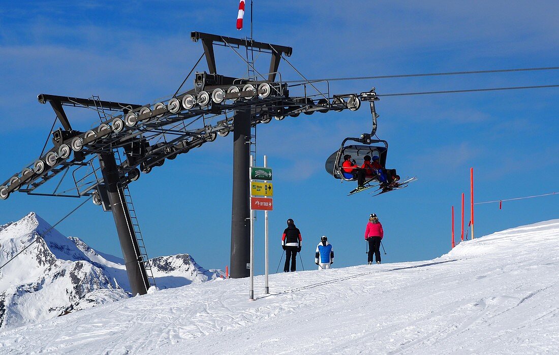 In Obertauern, ski area, pass, snow, sun, ski slopes, skiers, ski lifts, winter in Salzburg, Austria
