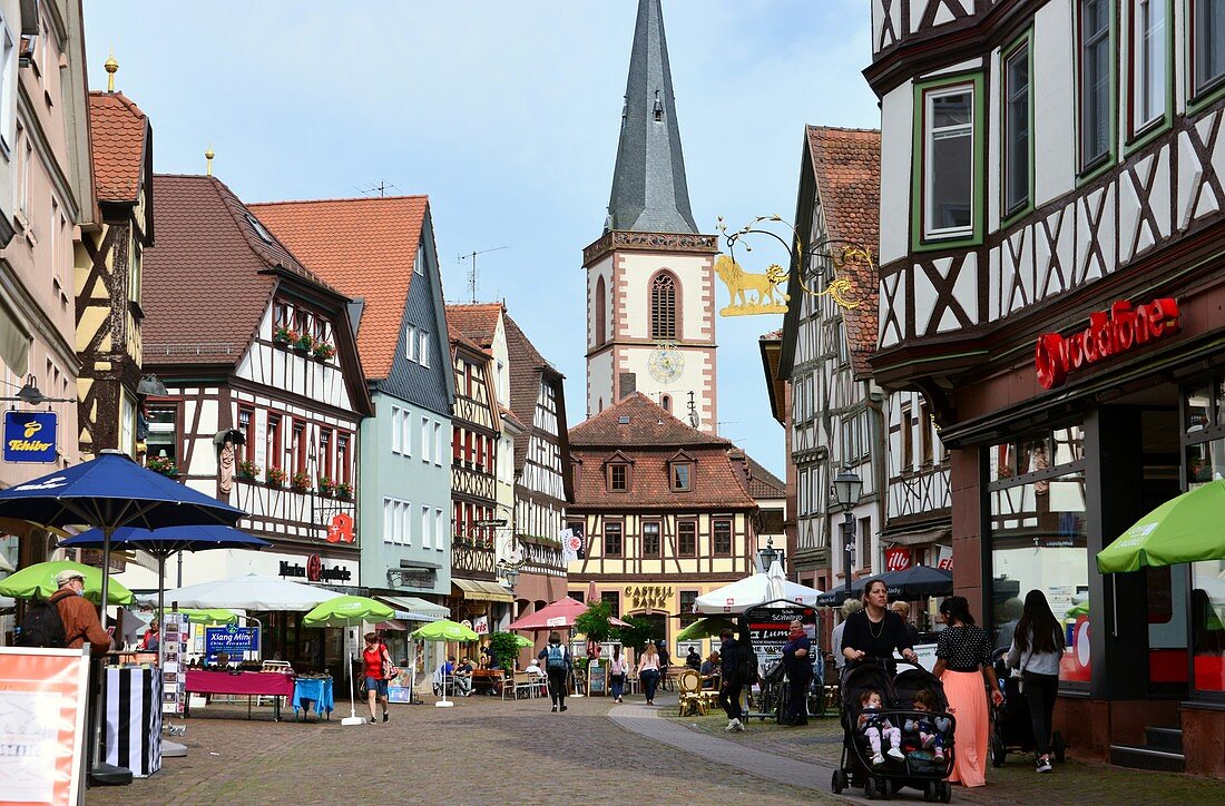 Rathausplatz, pedestrian street, shoppers, people, half-timbered houses, town church, Lohr am Main am Spessart, Lower Franconia, Bavaria, Germany