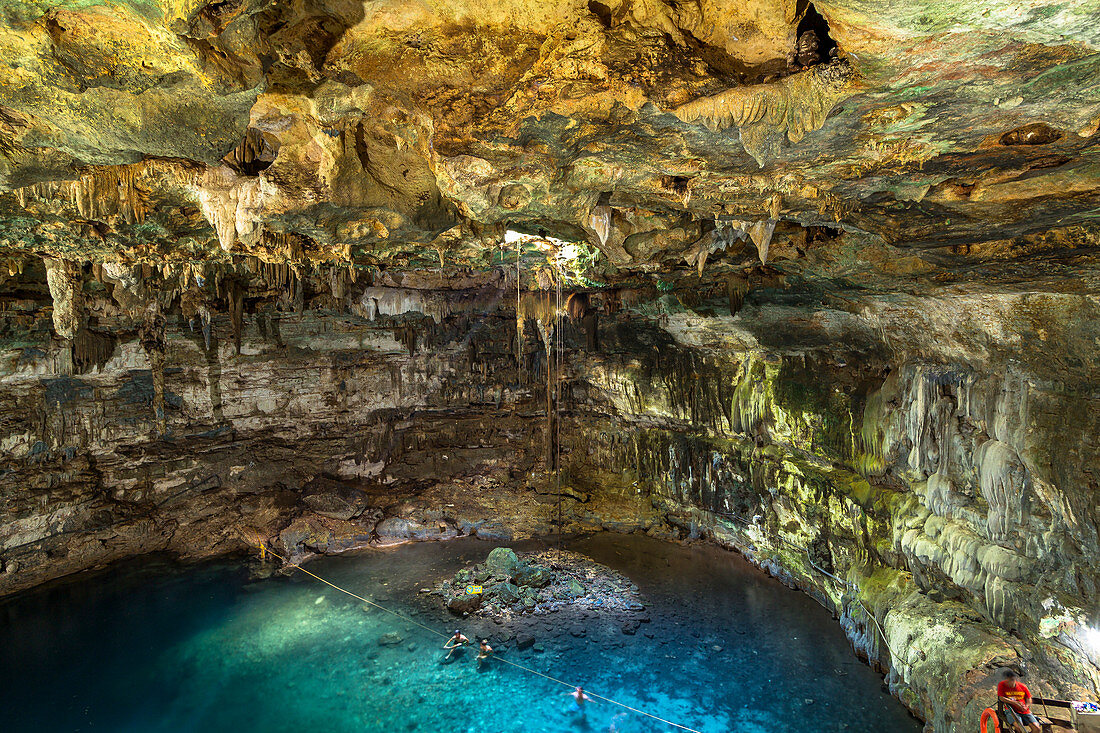 Cenote Samula - open karst cave filled with water in Tulum. Quintana Roo, Yucatan Peninsula, Mexico