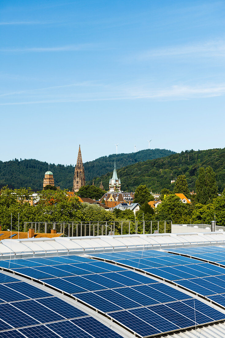City view with Freiburg Minster and photovoltaic system, Freiburg im Breisgau, Black Forest, Baden-Württemberg, Germany