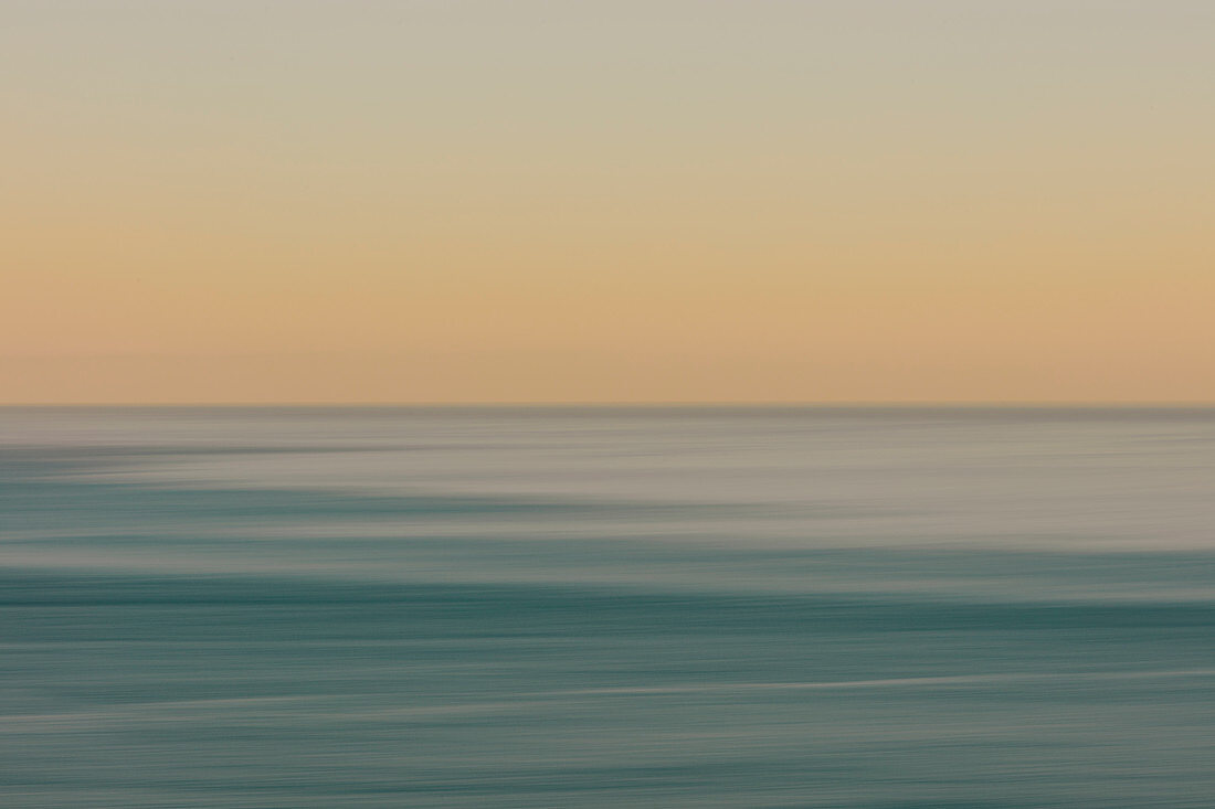 View of ocean, horizon and sky at dawn, blurred motion, northern Oregon coast