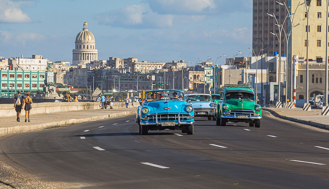Classic car on the Malecon - waterfront with a view of the Capitol. Old Havana, Cuba