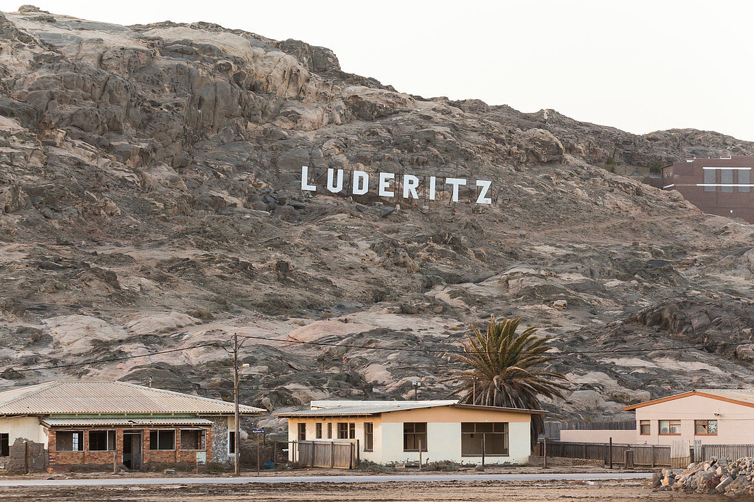 Lüderitz lettering in the mountain at the entrance to Lüderitz, Namibia