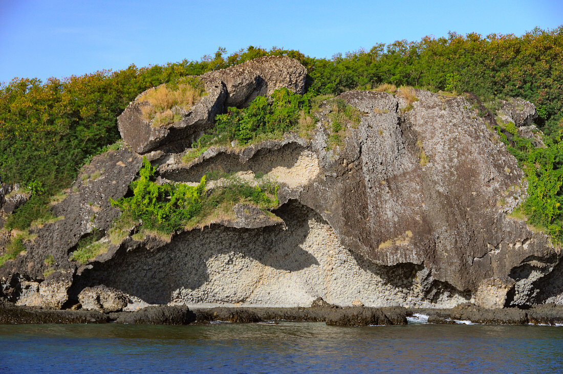 Rugged rocks on a small, uninhabited Pacific island, Fiji Islands
