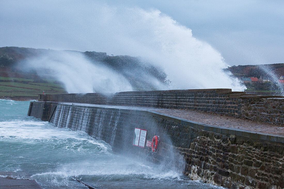 Goury harbor wall during storm surge, Normandy, France