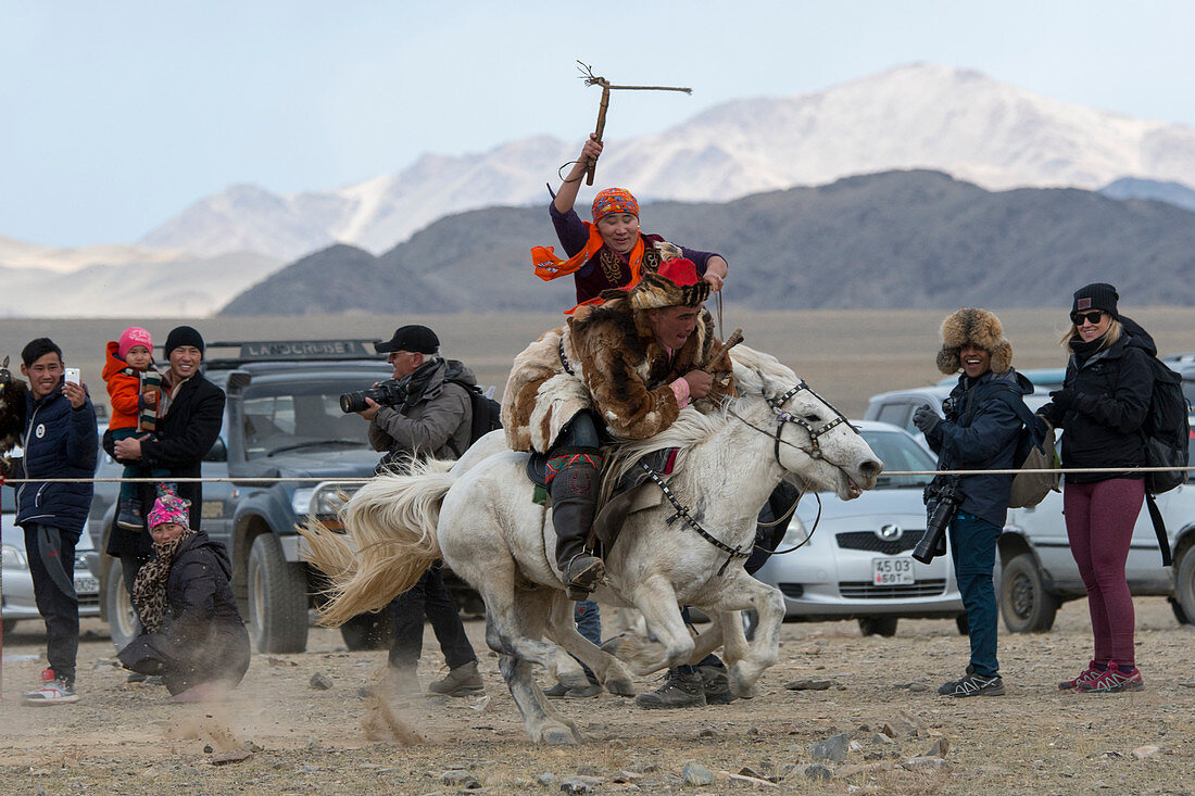 The Kyz Kuar (Catch up with a girl) game show is a traditional horseback riding game for couples were the boys being whipped by girls if the girl can catch the boy; at the Golden Eagle Festival near the city of Ulgii (Ölgii) in the Bayan-Ulgii Province in western Mongolia.