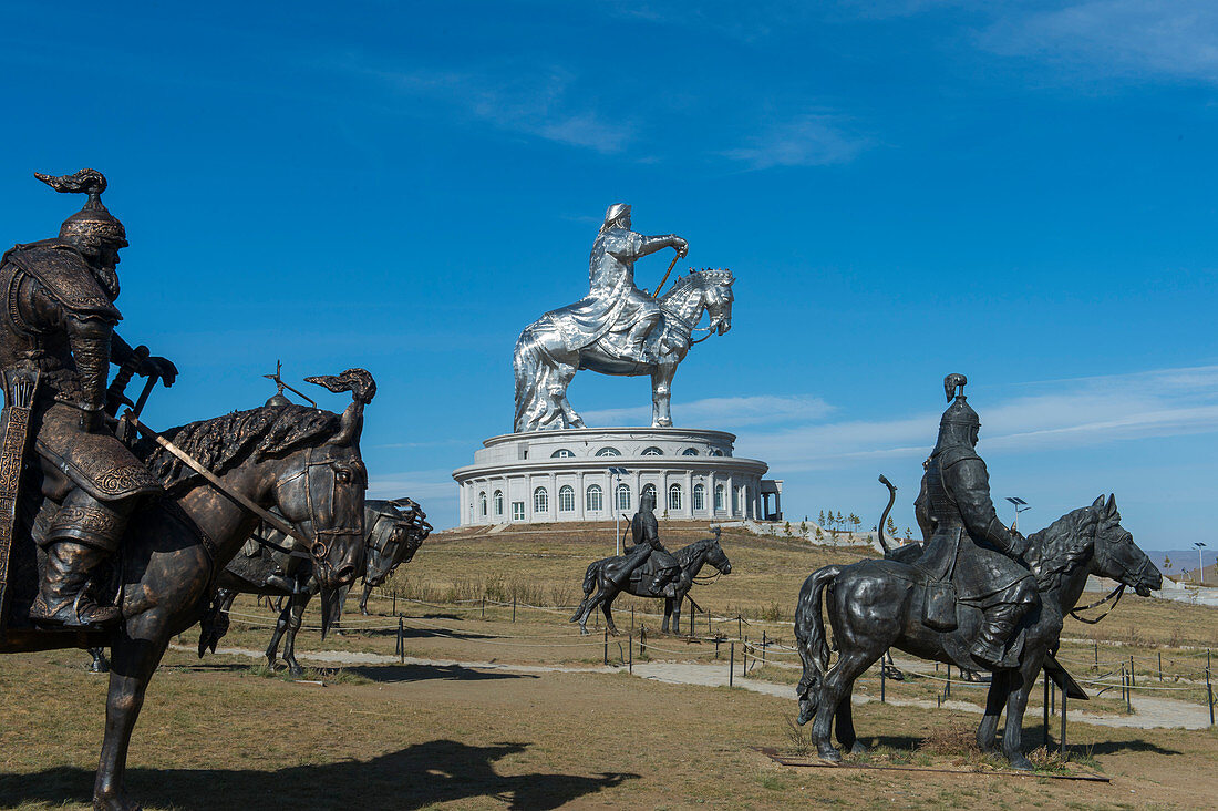 Bronze horsemen and the Genghis Khan Equestrian Statue (130 feet tall) are part of the Genghis Khan Statue Complex on the bank of the Tuul River at Tsonjin Boldog 33 miles east of Ulaanbaatar in Mongolia.