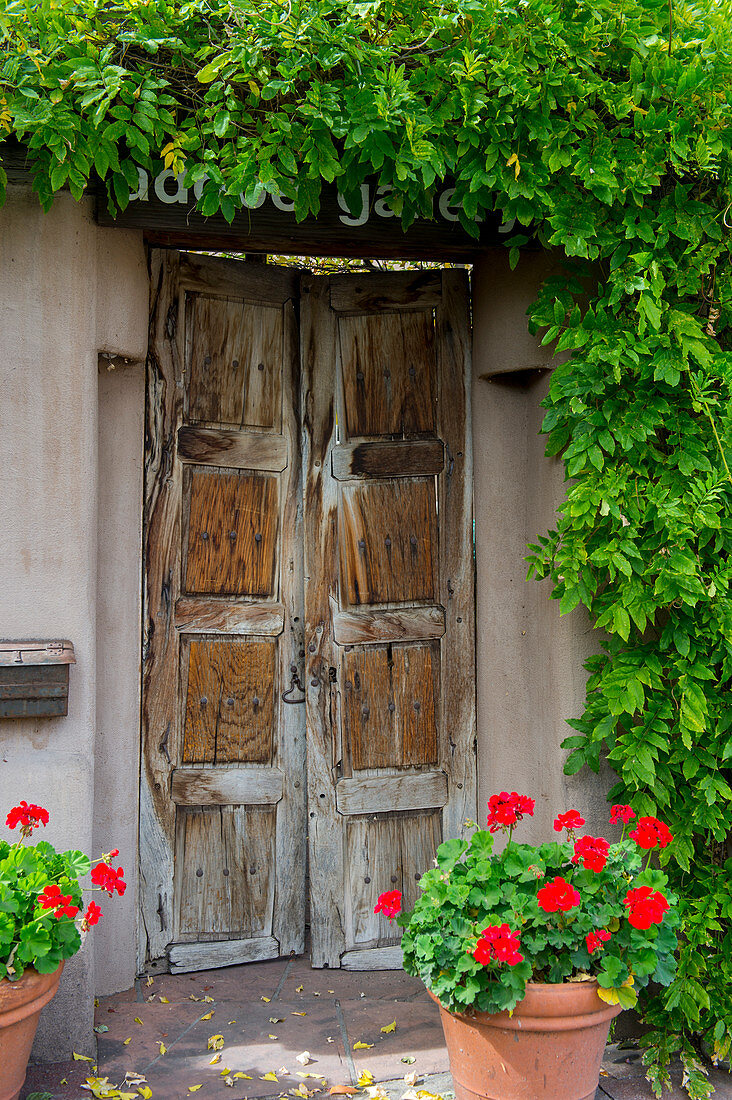 Old wooden door at the Adobe Gallery along Canyon Road in Santa Fe, New Mexico.