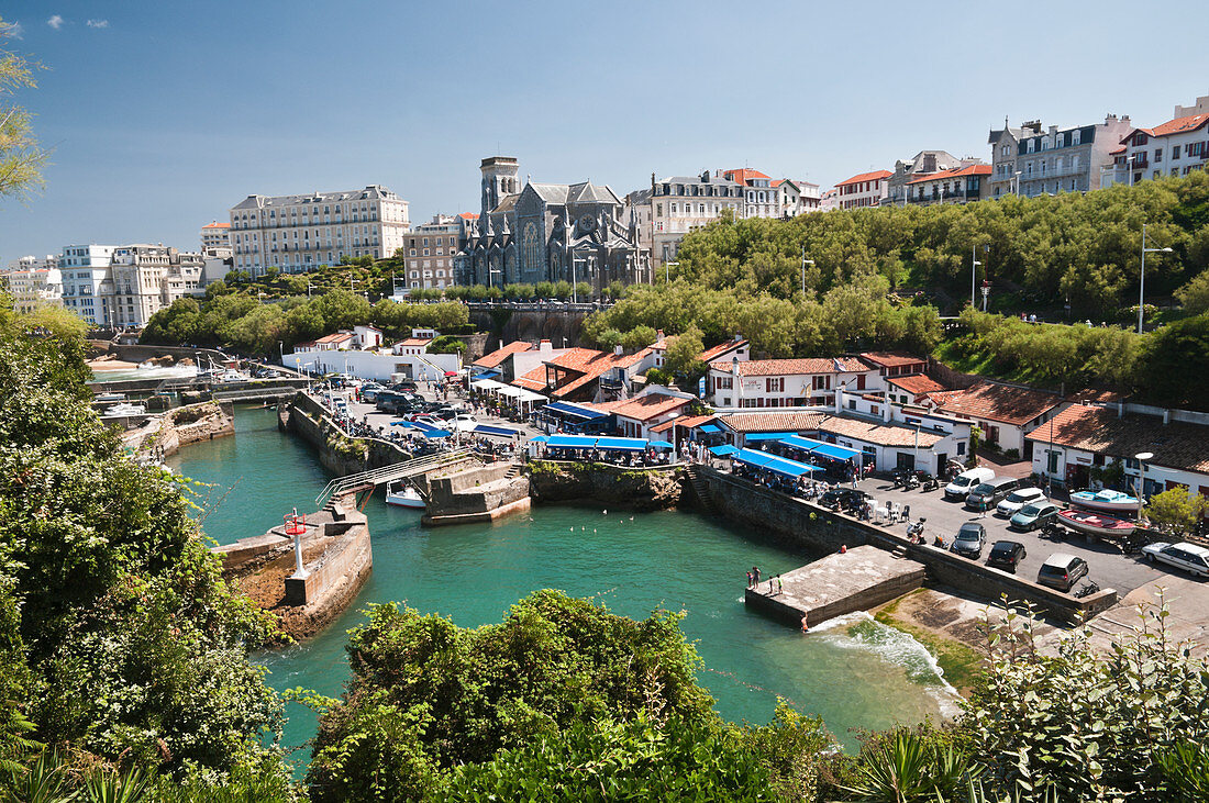 The old harbour with some seafood restaurants and the seafront promenade, Biarritz, France