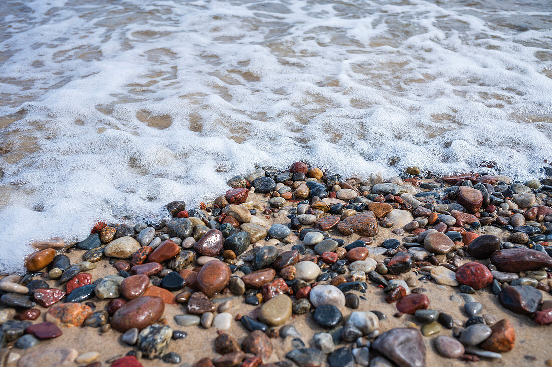 Baltic beach with stones and spray, Usedom, Mecklenburg-Western Pomerania, Germany
