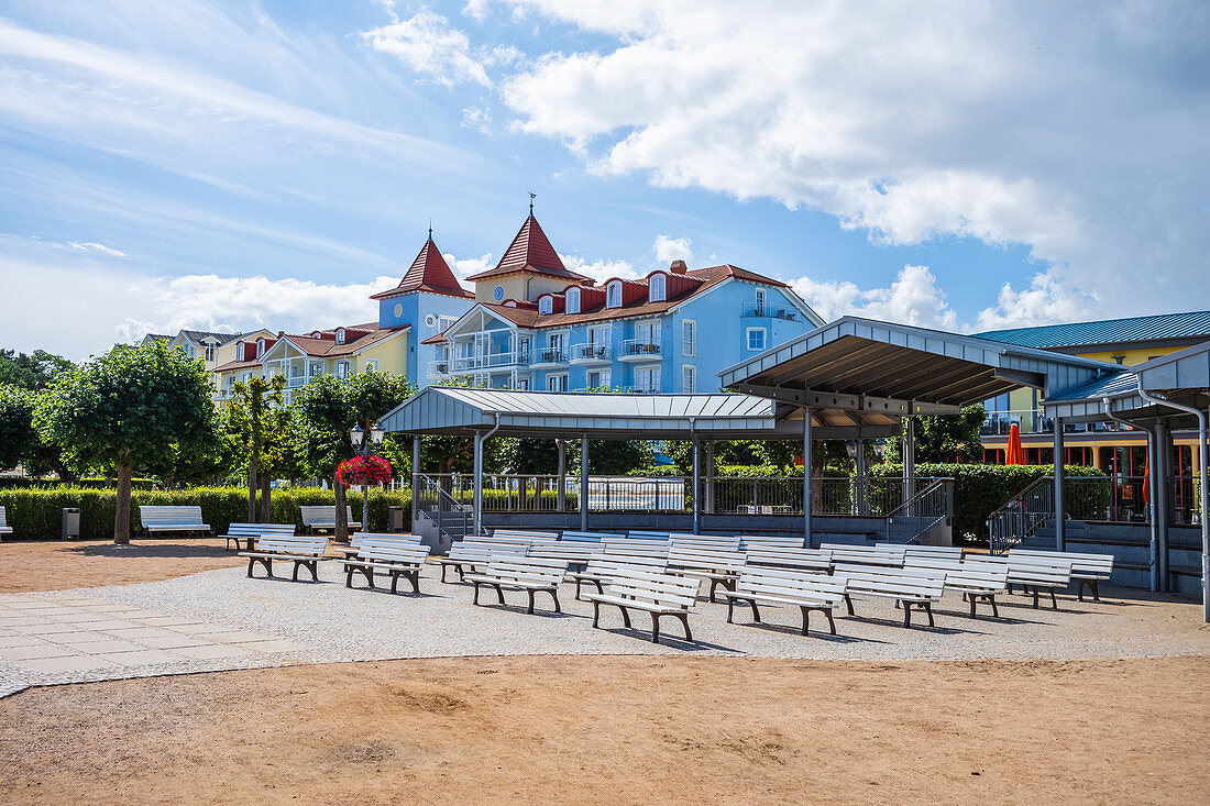 Benches at the open-air stage in Zinnowitz, beach promenade in summer with old villas in the background, Usedom, Mecklenburg-Western Pomerania, Germany