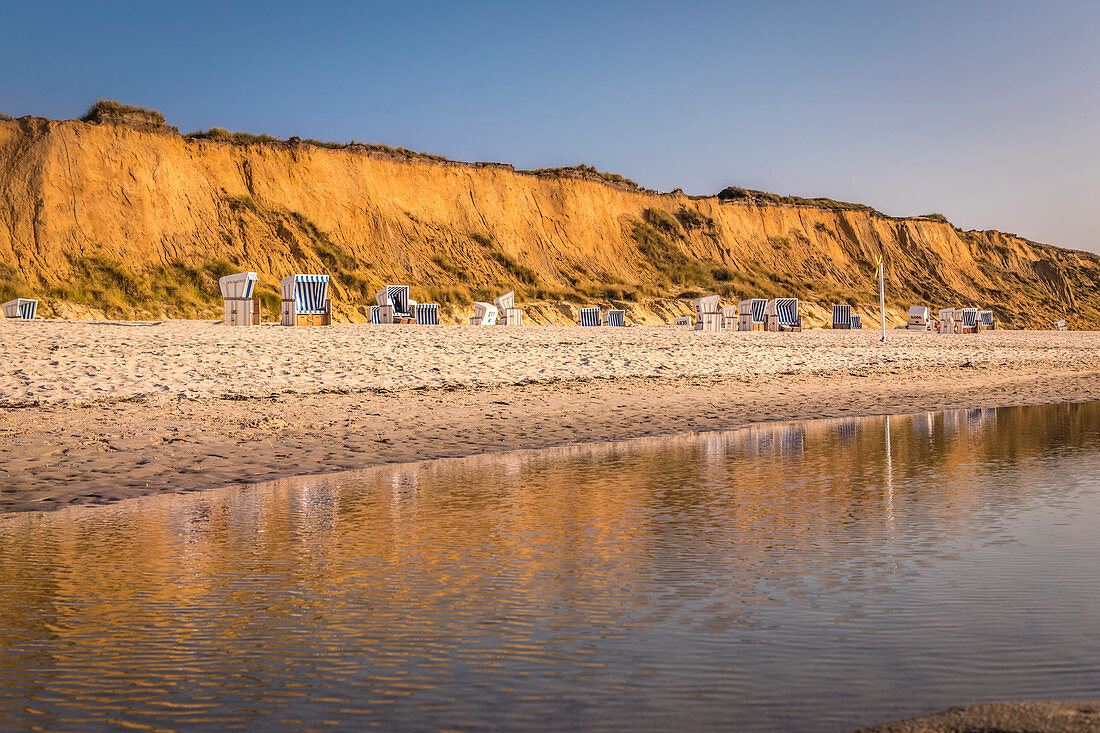 Red cliff with beach chairs in Kampen, Sylt, Schleswig-Holstein, Germany