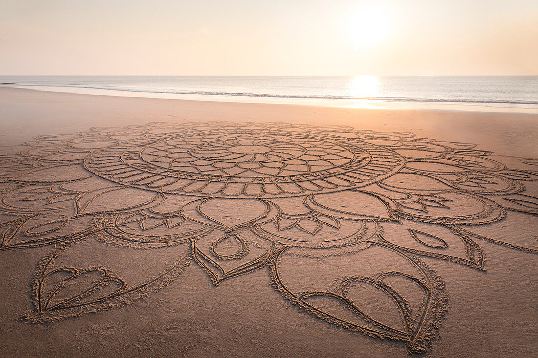 Mandala in the sand on the west beach of Kampen, Sylt, Schleswig-Holstein, Germany