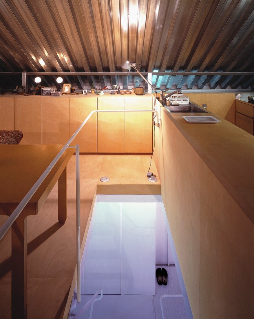 An attic room with a view of the stairs