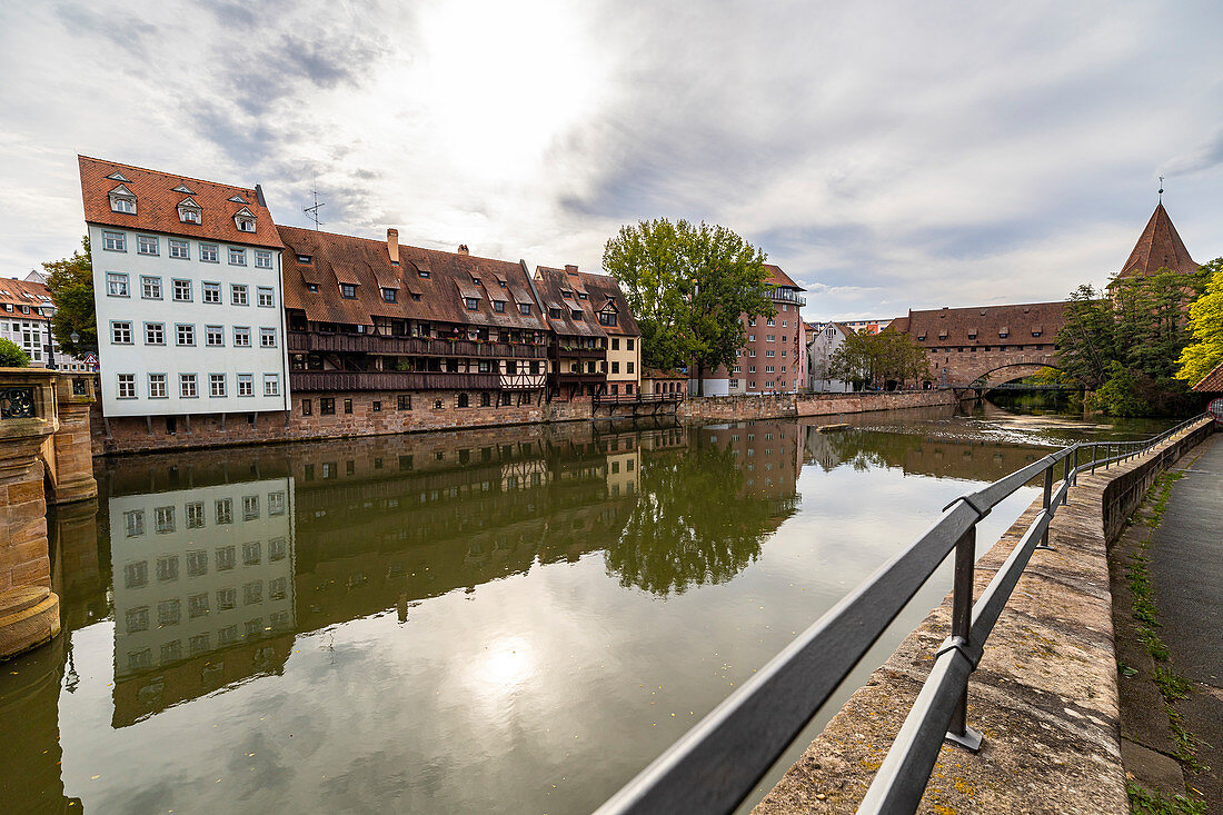 View from Maxbrücke to the Pegnitz (river) with historic house facades in the afternoon, Nuremberg city center, Franconia, Bavaria, Germany