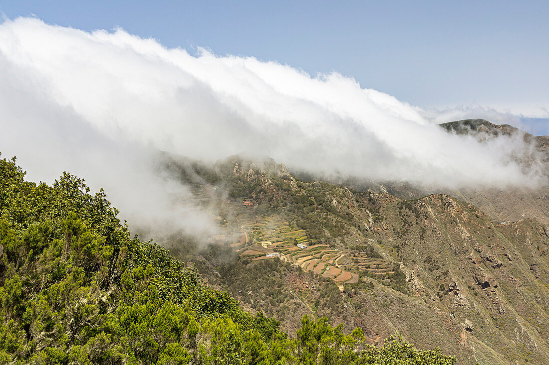 Clouds move over the mountain range in the Anaga Mountains, Tenerife, Spain