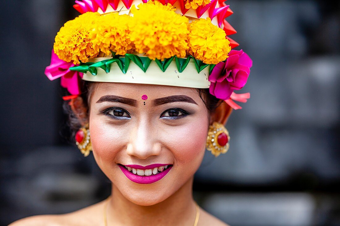 A Young Balinese Hindu Female In Festival Costume At The Batara Turun Kabeh Ceremony, Besakih Temple, Bali, Indonesia.