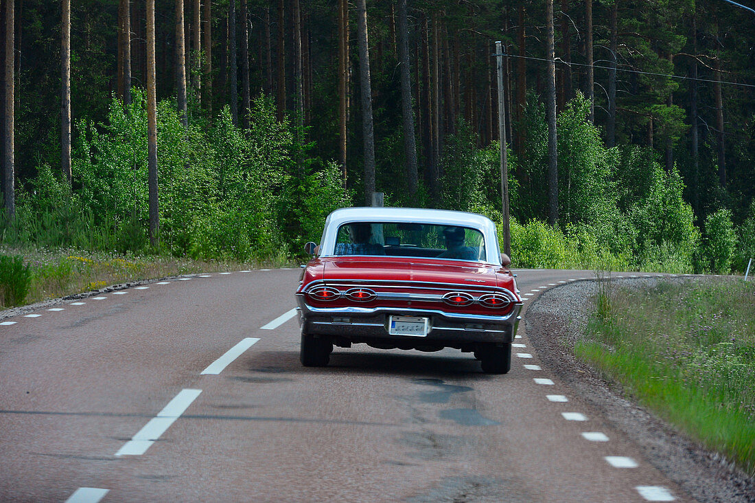 Vintage cars during the drive, near Sollerön, Dalarna Province, Sweden