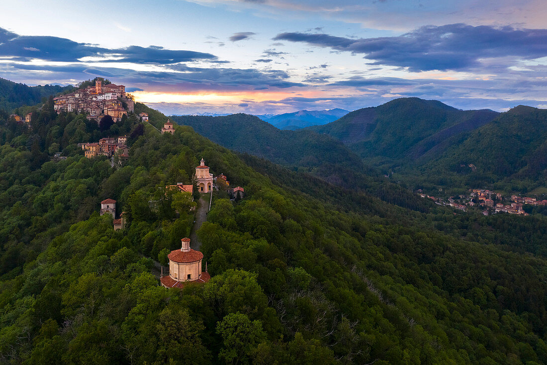 View of Santa Maria del Monte and the chapels of the sacred way during a spring sunset. Sacro Monte di Varese, Varese, Lombardy, Italy.